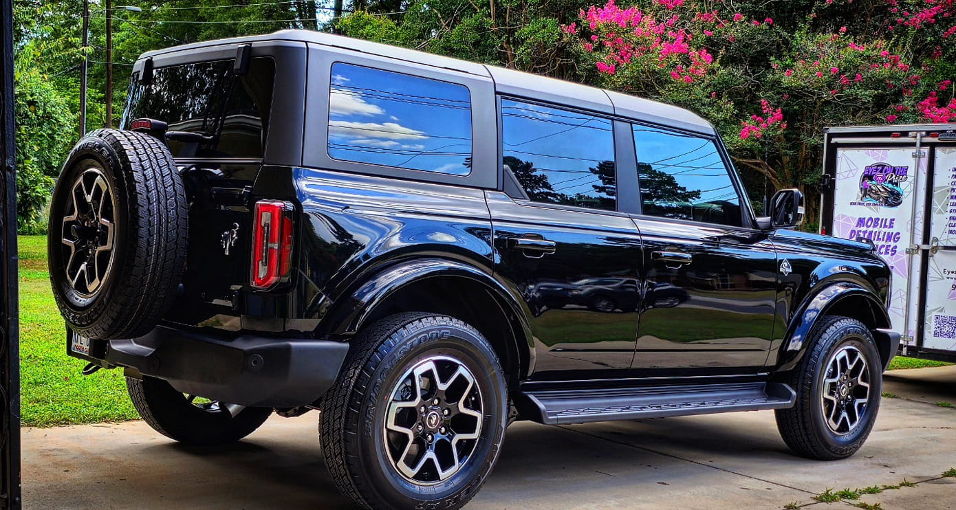 Full car detailing service on black SUV in Charlotte